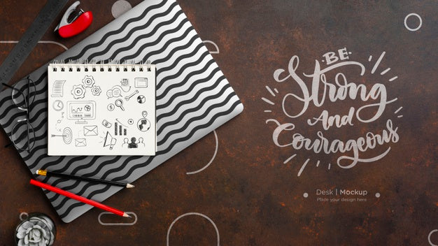 Flat Lay Of Desk Surface With Notebook And Pencils Psd