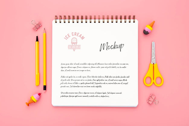 Flat Lay Of Desk Surface With Notebook And Scissors Psd
