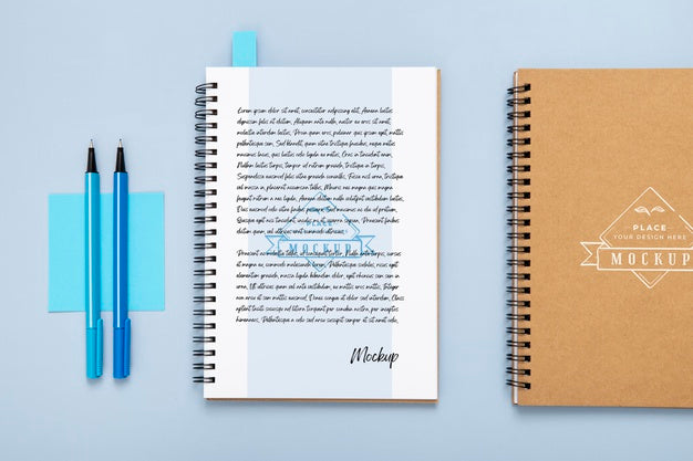 Flat Lay Of Desk Surface With Notebooks And Pens Psd