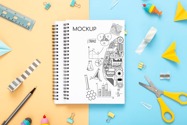 Flat Lay Of Desk Surface With Notebooks With Scissors Psd