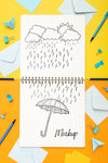 Flat Lay Of Desk Surface With Notepad And Pencils Psd