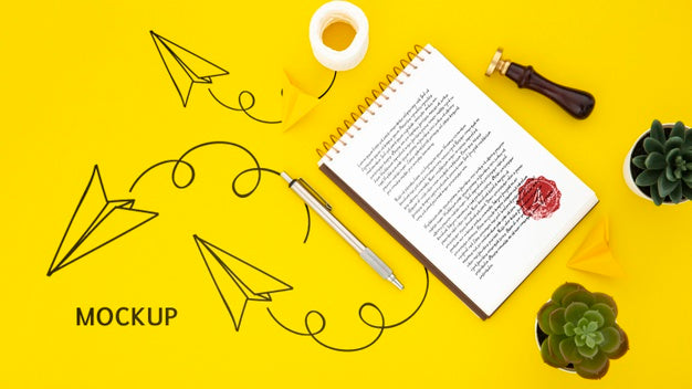 Flat Lay Of Desk Surface With Notepad And Succulents Psd