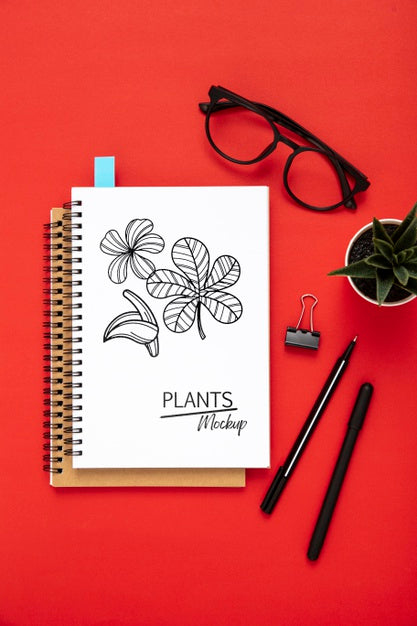 Flat Lay Of Desk Surface With Notepads And Glasses Psd