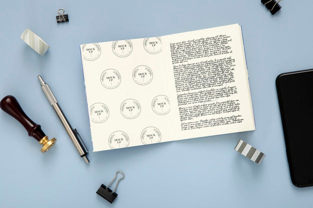 Flat Lay Of Desk Surface With Pen And Notepad Psd