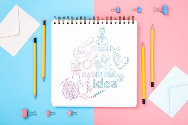 Flat Lay Of Desk Surface With Pencils And Notebook Psd