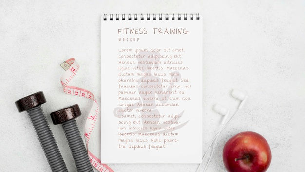 Flat Lay Of Fitness Notebook With Apple And Weights Psd