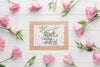 Flat Lay Of Frame And Flowers On Wooden Background Psd
