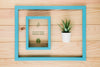 Flat Lay Of Frame In Frame With Succulent Psd