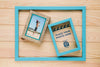 Flat Lay Of Frames In Frame On Wooden Background Psd