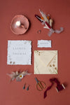Flat Lay Of Mock-Up Rustic Paper Wedding Invitation With Leaves And Flowers Psd