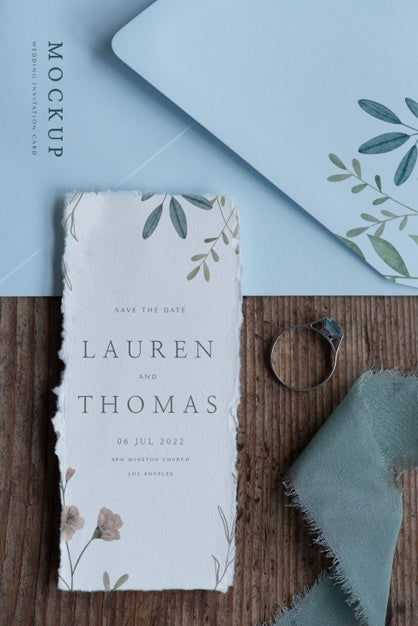 Flat Lay Of Mock-Up Rustic Paper Wedding Invitation With Leaves And Flowers Psd