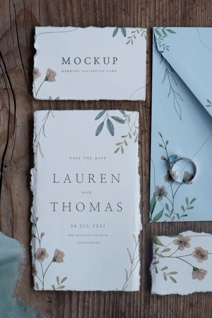 Flat Lay Of Mock-Up Rustic Paper Wedding Invitation With Leaves And Flowers Psd