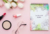 Flat Lay Of Notebook With Tulips And Make-Up Essentials Psd