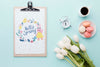 Flat Lay Of Notepad With Tulips And Macarons Psd