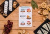 Flat Lay Of Notepad With Variety Of Cheese And Grapes Psd