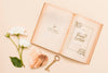 Flat Lay Of Open Book With Roses And Key Psd