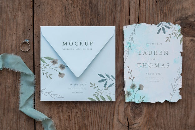 Flat Lay Of Paper Mock-Up Rustic Wedding Invitation With Leaves And Flowers Psd
