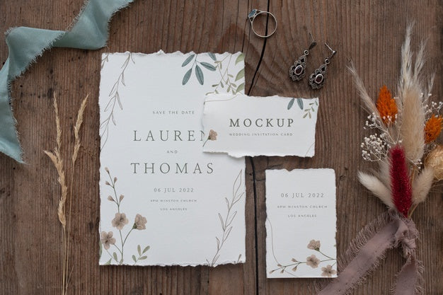 Flat Lay Of Paper Mock-Up Rustic Wedding Invitation With Leaves And Flowers Psd