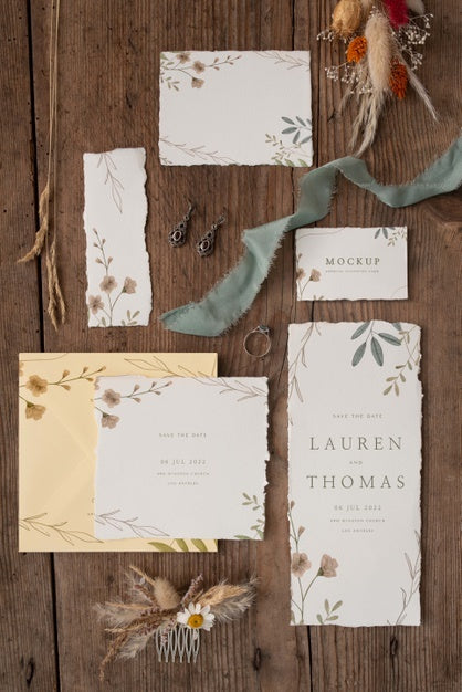 Flat Lay Of Paper Mock-Up Rustic Wedding Invitation With Leaves And Flowers Psd