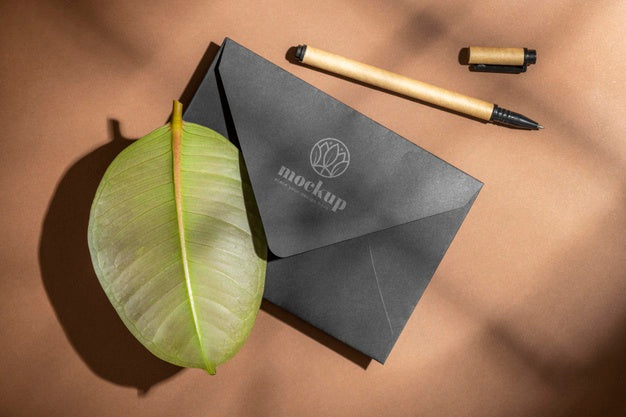Flat Lay Of Paper Stationery With Pencil And Leaf Psd
