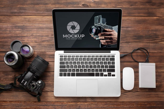 Flat Lay Of Photographer Wooden Workspace With Laptop Psd