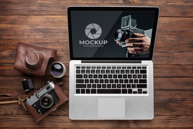 Flat Lay Of Photographer Wooden Workspace With Laptop Psd