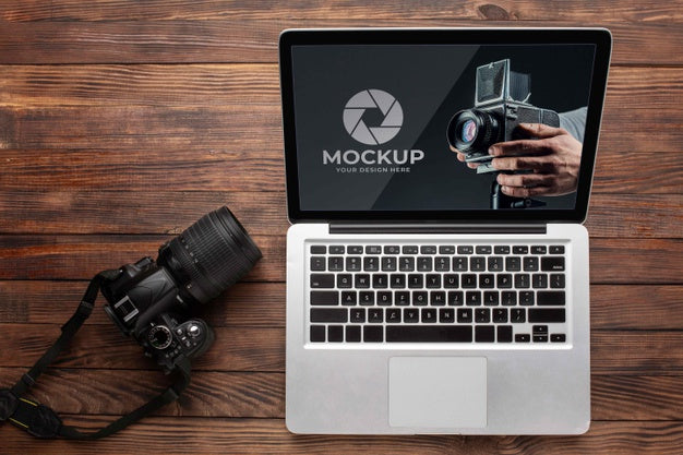Flat Lay Of Photographer Wooden Workspace With Laptop Psd