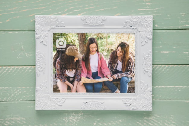 Flat Lay Of Rectangular Frame On Wooden Background Psd