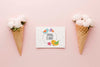 Flat Lay Of Roses In Ice Cream Cones With Card Psd