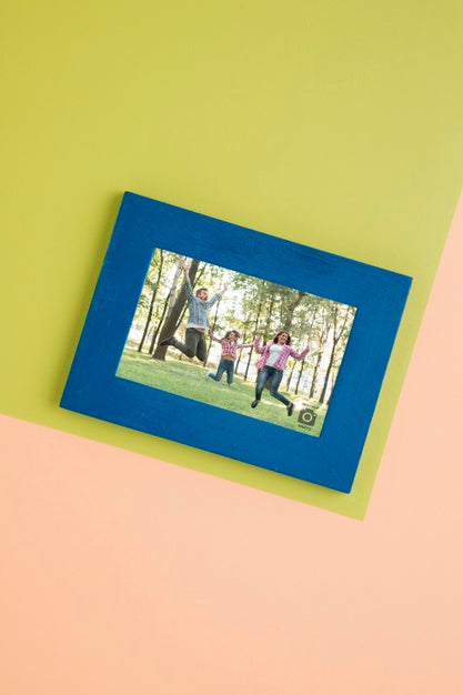 Flat Lay Of Simple Frame For Photographs Psd