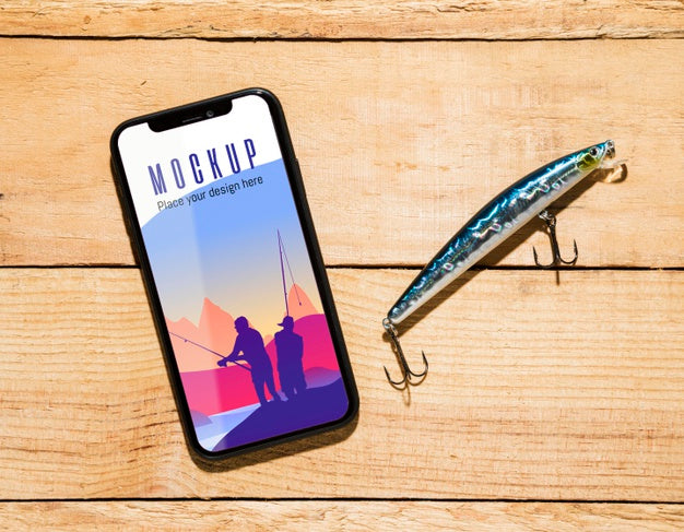 Flat Lay Of Smartphone With Fish Bait Psd