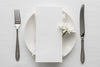 Flat Lay Of Spring Menu Mock-Up On Plate With Cutlery And Flower Psd