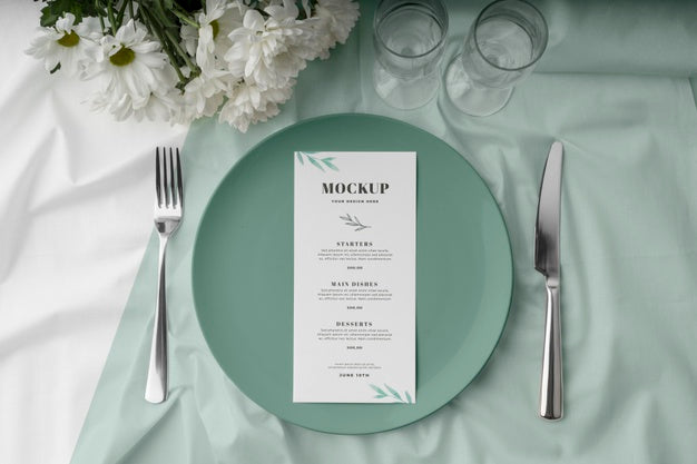 Flat Lay Of Spring Menu Mock-Up On Plate With Cutlery And Glasses Psd