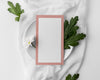 Flat Lay Of Table Arrangement With Spring Menu Mock-Up On Plate And Flower Psd