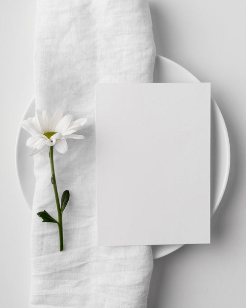 Flat Lay Of Table Arrangement With Spring Menu Mock-Up On Plate And Towel Psd