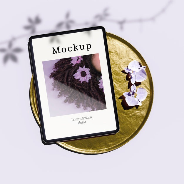 Flat Lay Of Tablet On Golden Tray With Flowers Psd