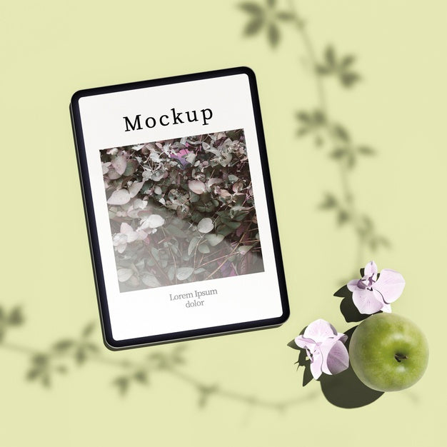 Flat Lay Of Tablet With Apple And Flowers Psd