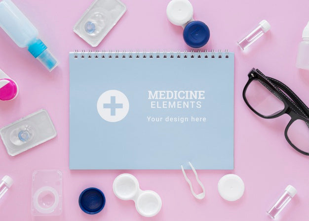 Flat Lay Optics Still Life Arrangement With Notepad Mock-Up Psd