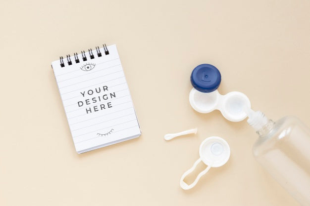 Flat Lay Optics Still Life Composition On Beige Background With Notepad Mock-Up Psd