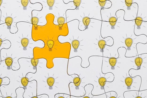 Flat Lay Puzzle With Light Bulbs Psd