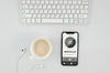 Flat Lay Smartphone Mock-Up With Cup And Earphones On Desk Psd