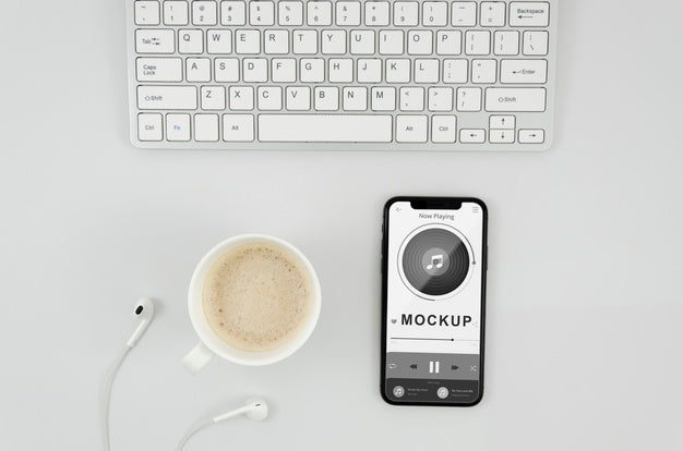 Flat Lay Smartphone Mock-Up With Cup And Earphones On Desk Psd