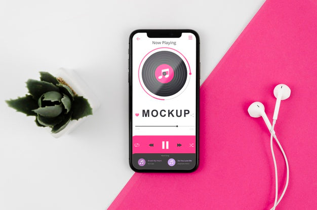 Flat Lay Smartphone Mock-Up With Earphones And Plant Psd