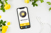 Flat Lay Smartphone Mock-Up With Flowers And Earphones Psd