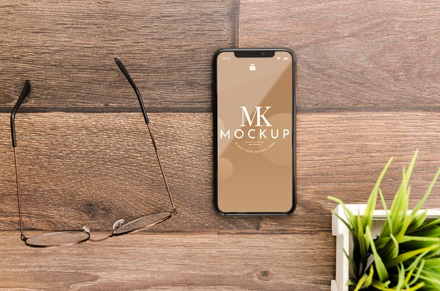 Flat Lay Smartphone Mock-Up With Glasses On Desk Psd