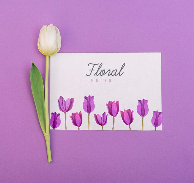 Flat Lay White Tulip Next To Card Mockup Psd