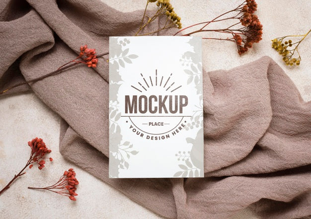 Flay Lay Autumn Mock-Up With Flowers On Grey Cloth Psd