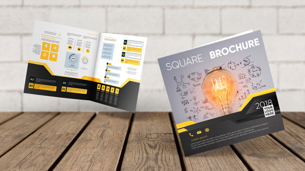 Floating Square Brochure Mockup Above Wooden Surface Psd
