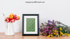 Floral Mockup Of Frame On Desk Psd