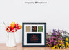 Floral Mockup Of Frame On Tabletop Psd